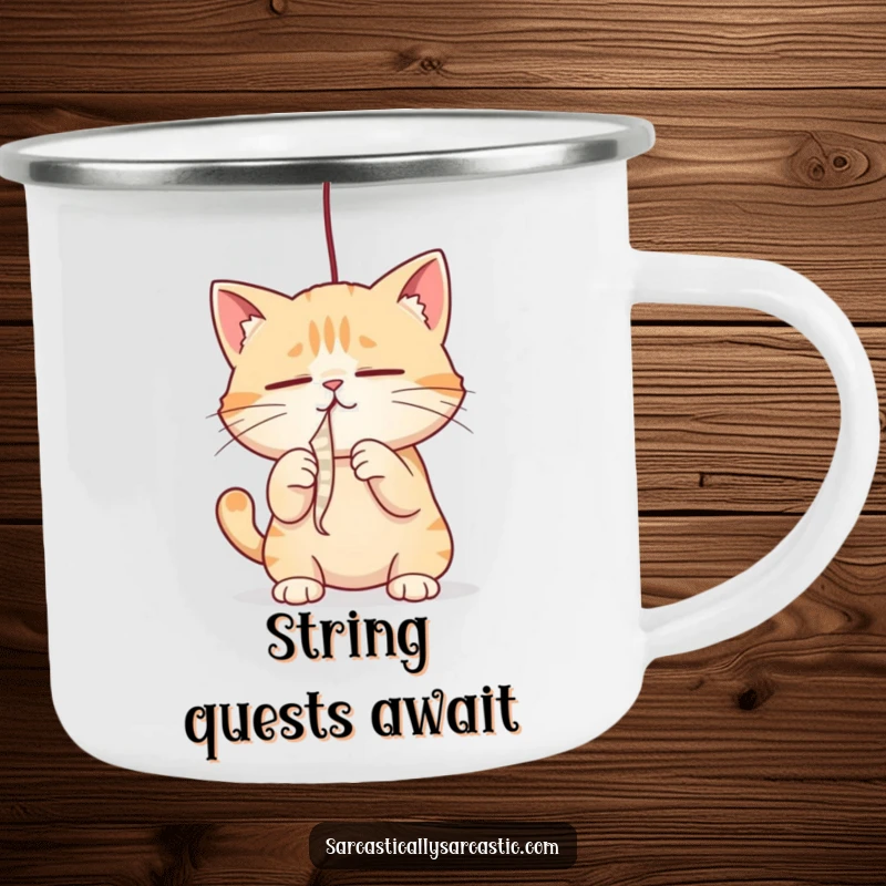 Funny cat camping mug with a cat intensely batting a dangling string, perfect for outdoor trips, a funny gift.