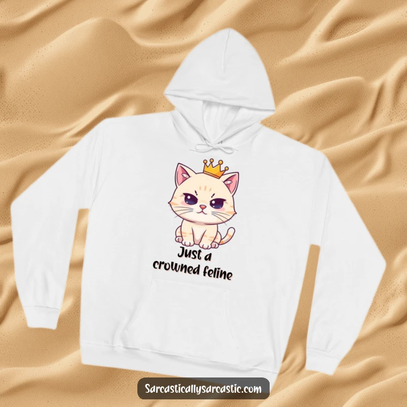 Funny hoodie with a cute, crowned cat character delivering a deadpan stare; perfect for cozy, humorous wear.