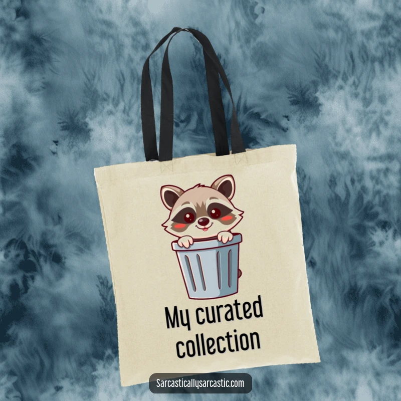 Funny raccoon tote bag displaying a cheerful raccoon peeking from behind a trash can with a mischievous smirk.